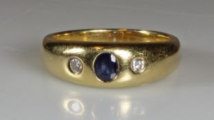 Bandring, Atelier Richarz, Bonn (lt. Angaben), GG 750, 2 Brillanten, 1 oval facettierter Saphir, 8