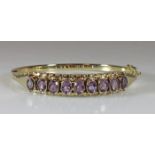 Armreif, GG 585, 9 oval facettierte Amethyste zus. ca. 4.50 ct., 20.3 g