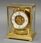 Uhr mit Wandkonsole, "Atmos", Jaeger LeCoultre, 1970er Jahre, Messinggehäuse, allseitig verglast,