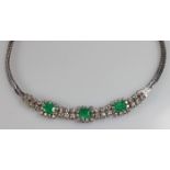 Collier, WG 750, 3 Smaragde zus. ca. 3.60 ct., im Smaragdschliff, 25 Brillanten zus. ca. 2.35 ct.,