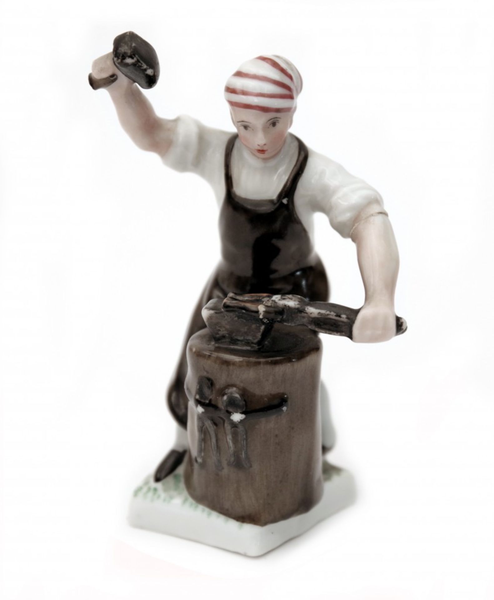 A Porcelain Blacksmith Figure