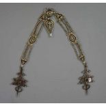 BERBERSCHMUCK: FIBELN UND KETTE, Taroudannt / Marokko, 1. Hälfte 20. Jh., Silber, Gewicht 233 g.