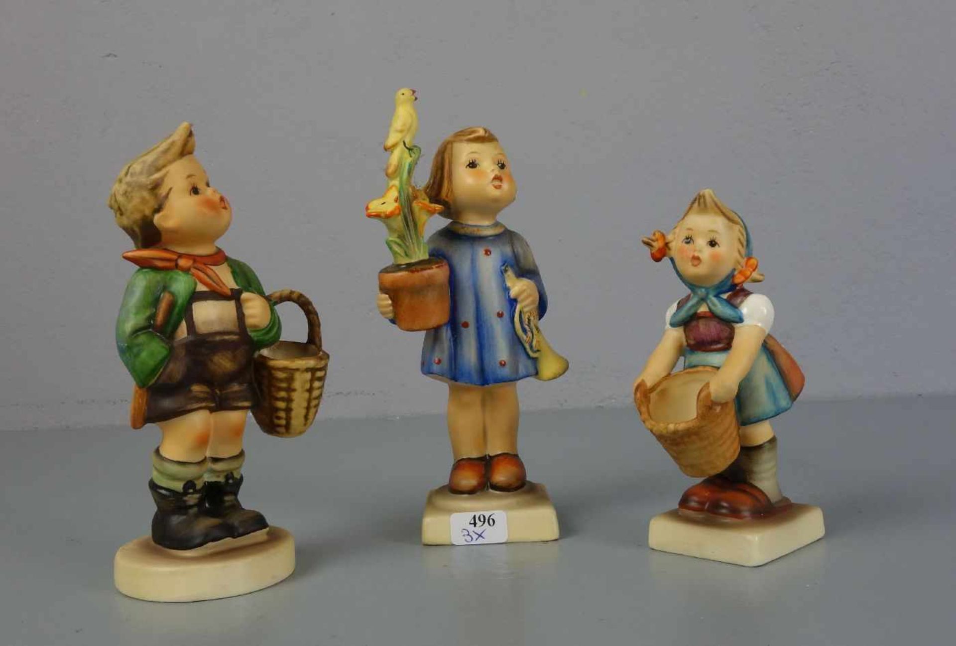 DREI HUMMELFIGUREN / three porcelain figures, 20. Jh., Porzellan, polychrom staffiert.1) "Ich
