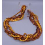 BERNSTEINKETTE / amber necklace, 6 Stränge aus Bernsteinen unterschiedlicher Farbigkeit, Form und