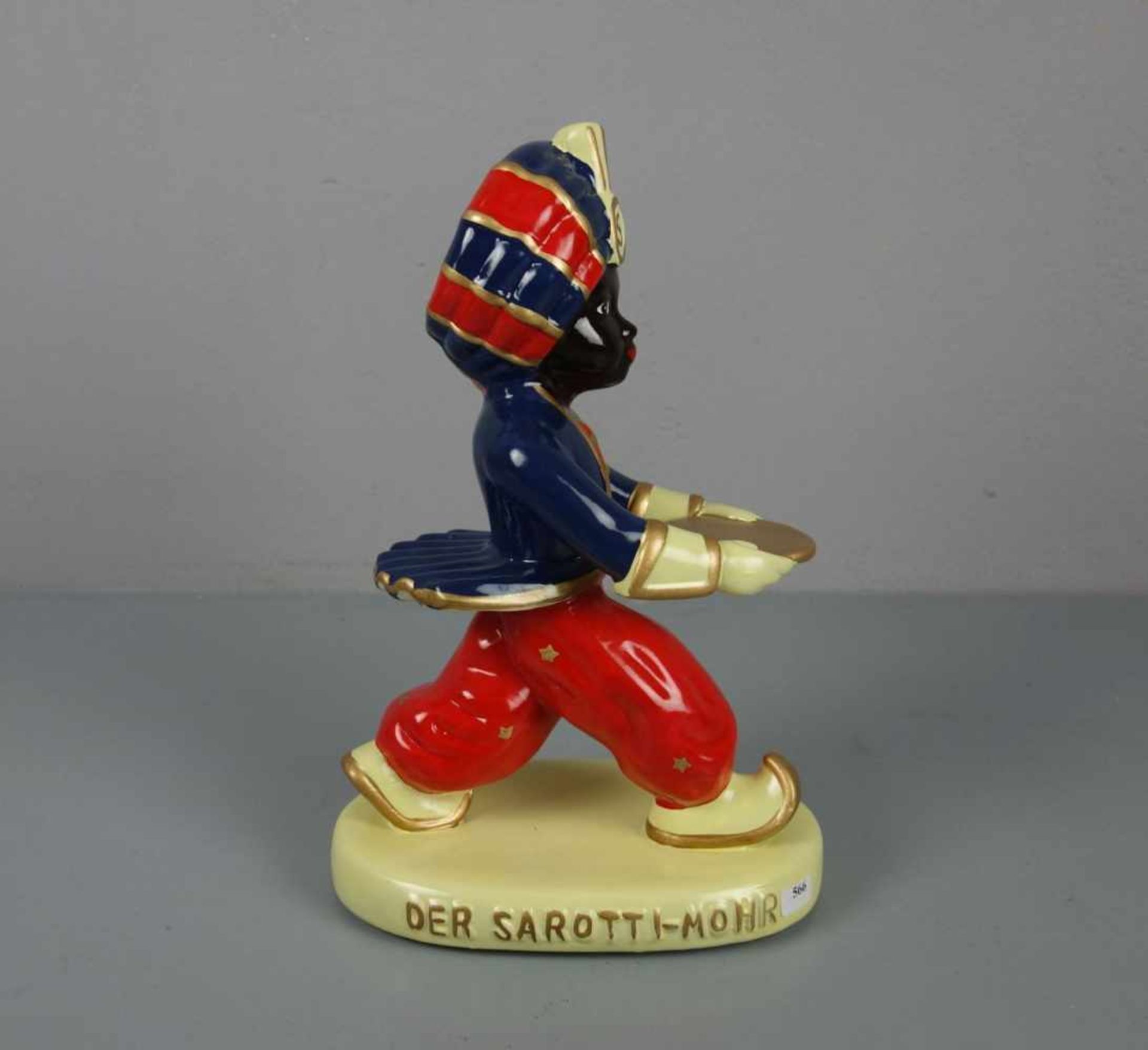 PORZELLANFIGUR / porcelain figure: "Der Sarotti - Mohr" (so auch bezeichnet / Originaltitel),