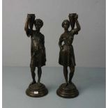 BILDHAUER DES 20. Jh., Skulpturenpaar / pair of sculptures: "Figürliches Leuchterpaar / Paar '