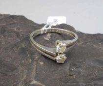 BRILLANT - RING, 585er Weissgold (4 g). Zweiteilige und durchbrochene Ringschiene, besetzt mit