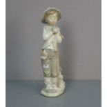FIGUR: "Knabe mit Vogel" / porcelain figure: "boy with a bird", Porzellan, Manufaktur Nao,