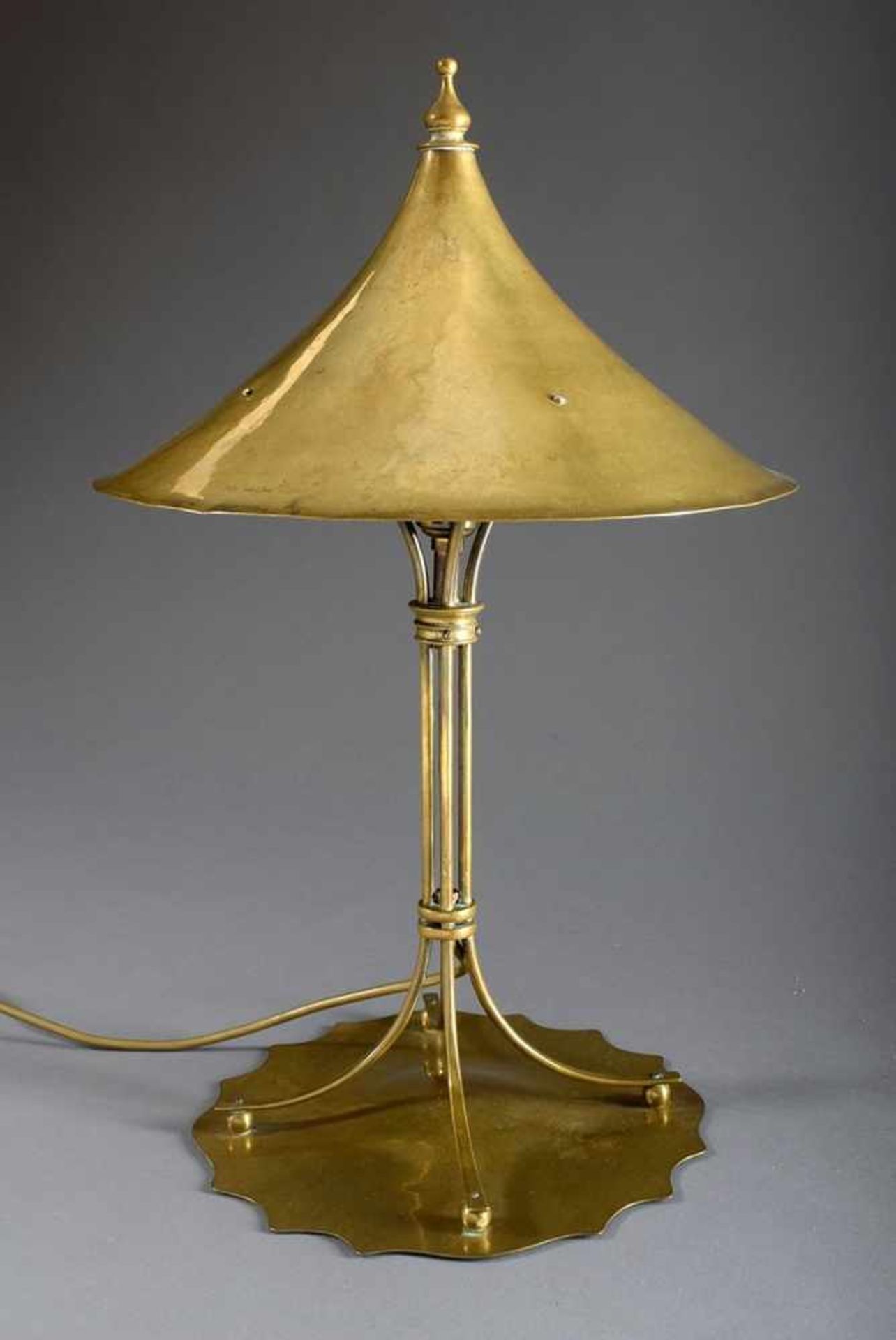 Marbled brass Arts and Craft table lamp with pagoda shade on fourfold column and curved base,