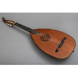 Guitar lute with 11-span lute body and scalloped fingerboard, carved volute head with plastic