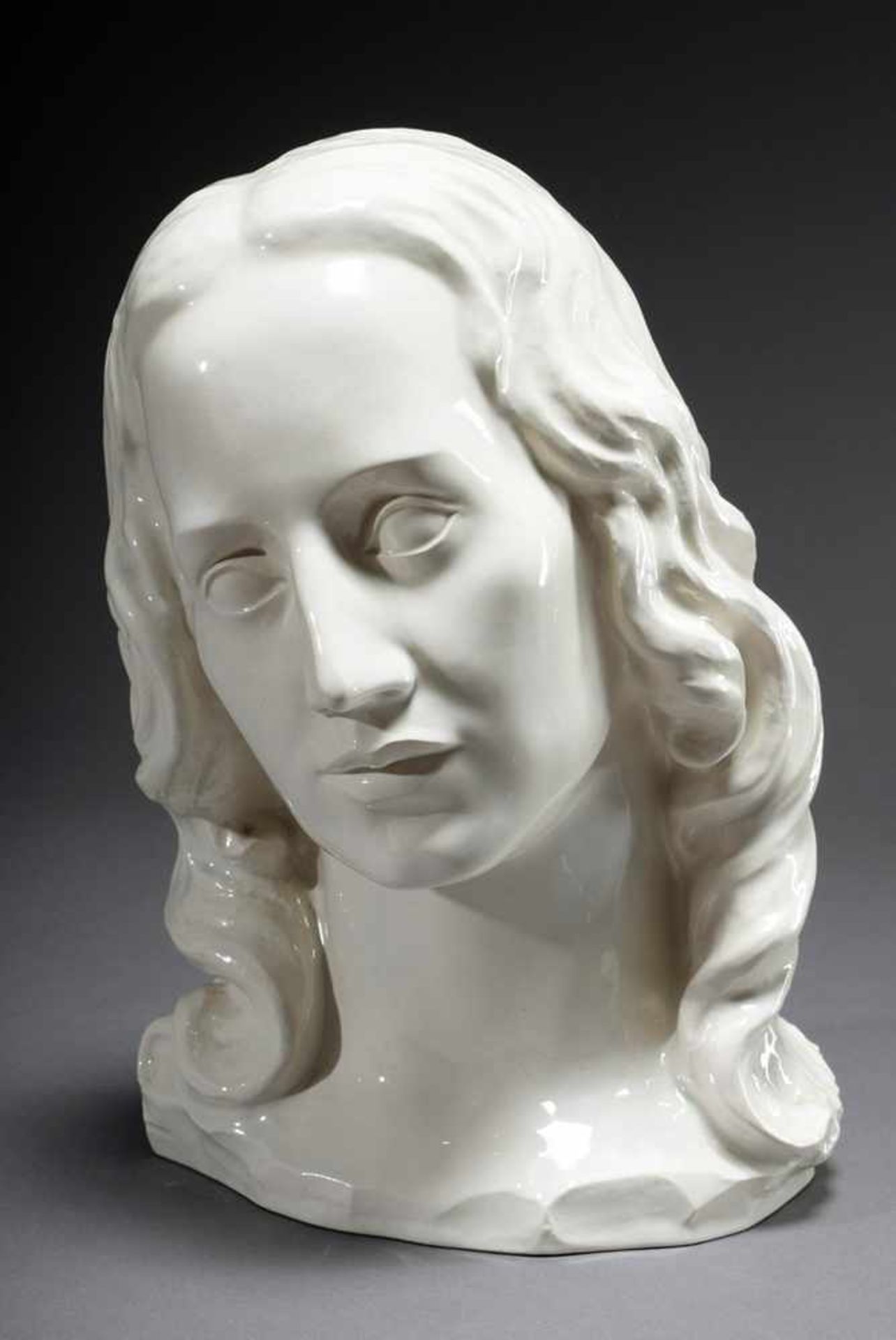 Unknown artist around 1910/20 "Female head", white glazed stoneware, h. 27cm, chip at the stand