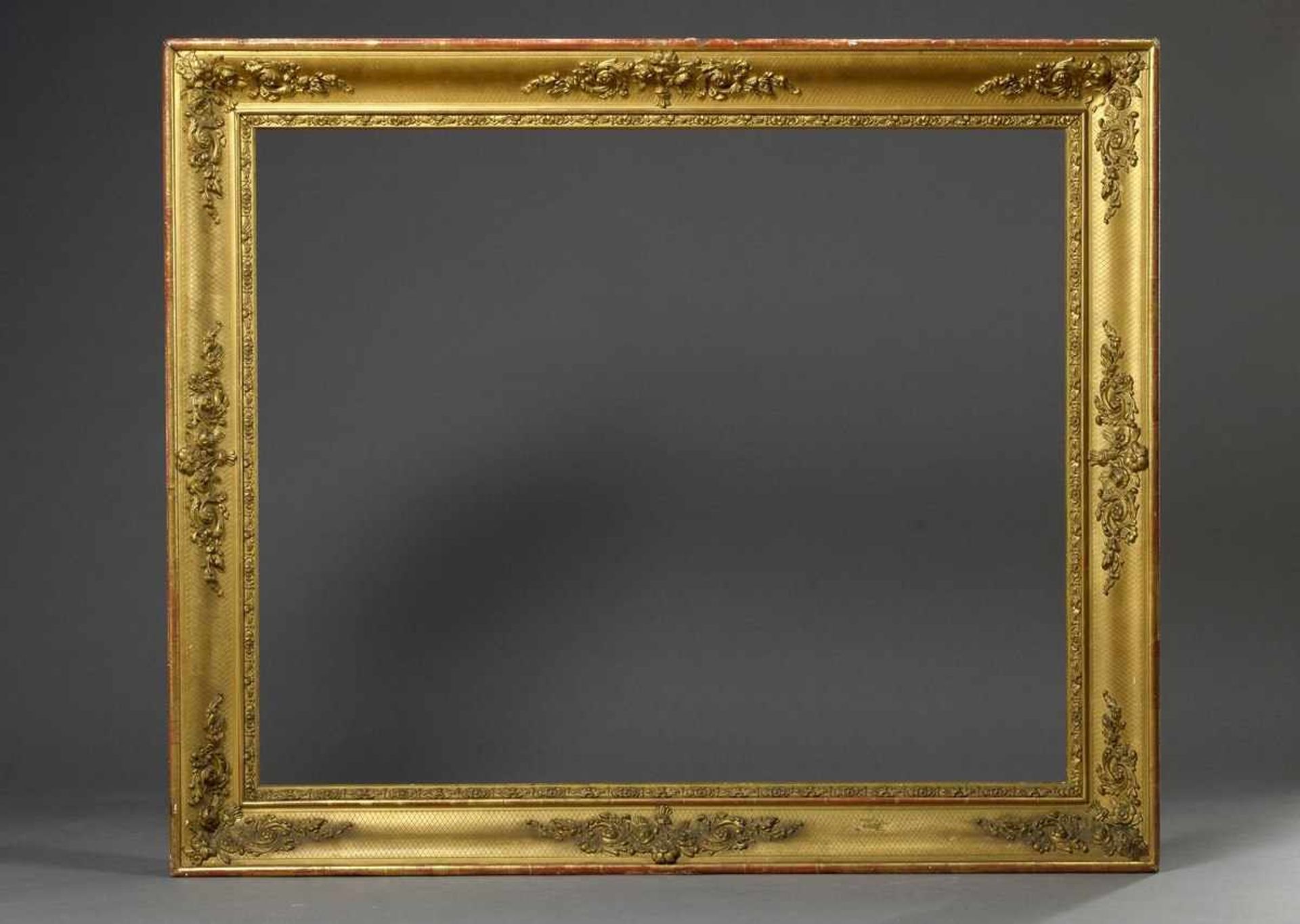 Big gilded frame with groove and stuccoed floral decor over rhombic pattern, 19th century, RD 79,