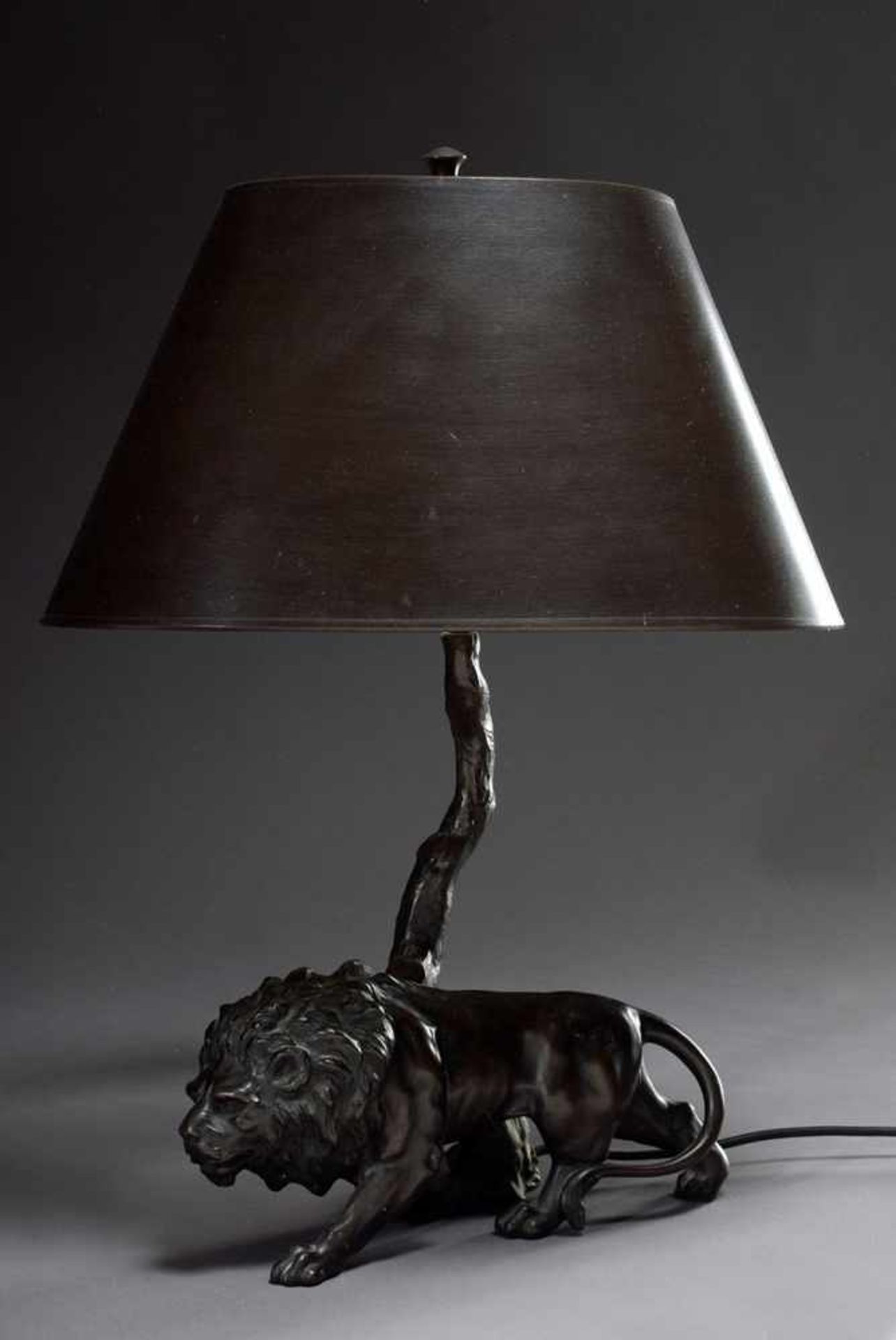 Table lamp "Stepping lion under a tree", galvanized zinc cast with matching dark brown patinated