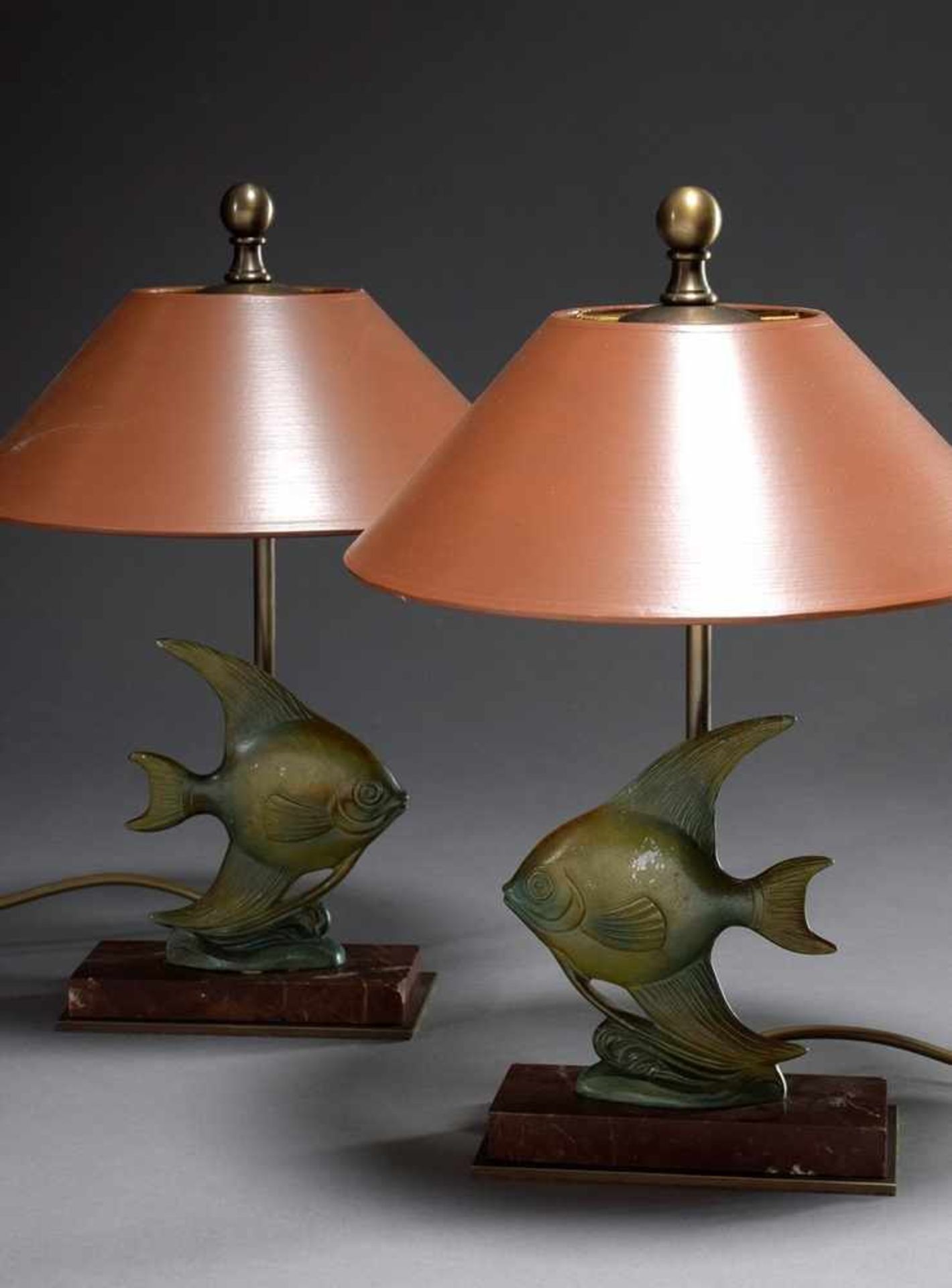 Pair of Midcentury lamps "Fish", galvanized zinc cast with greenish patina, h. 37,5cmPaar Midcentury