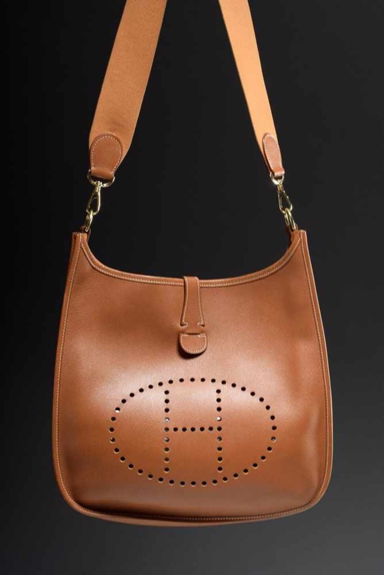 Hermès "Evelyn", 1996, cognac coloured calfskin, open shoulder bag with perforated "H" logo and