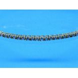 Schmales Tennisarmband mit 1,2 ct Brillanten, zusammen 1,2 ct (lt. Gravur), 21. Jh. 750/-