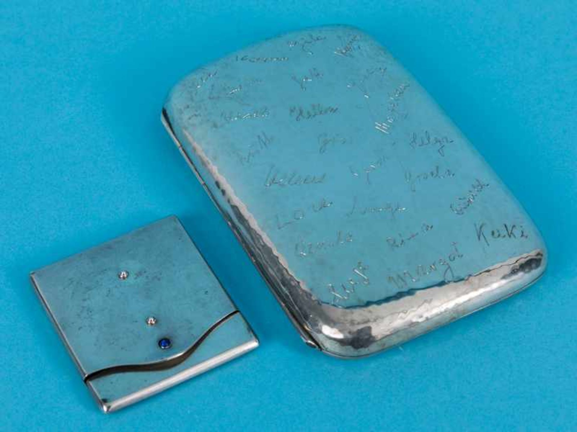 2 verschiedene Etuis, u.a. Dänemark, 1929. Silber (1 x 800/-), Gesamtgewicht ca. 178 g; größeres