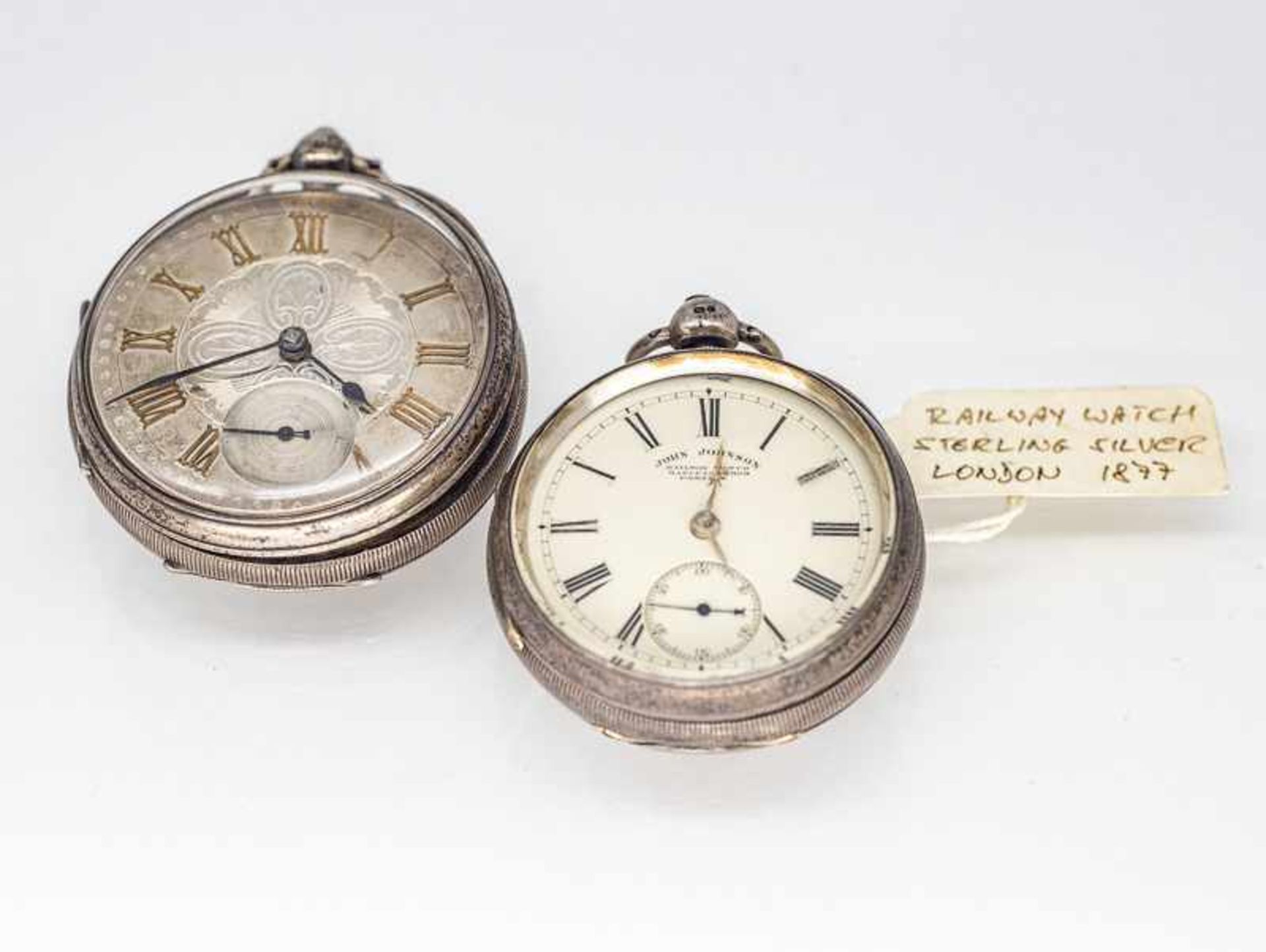 2 verschiedene Taschenuhren (railway watches), u.a. John Johnson/ Preston, London u. Chester, 1877