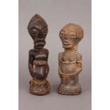 2 afrikanische Ritualfiguren der Songye, KongoHolz, geschnitzt, mit Kordelband und Schlangenhau