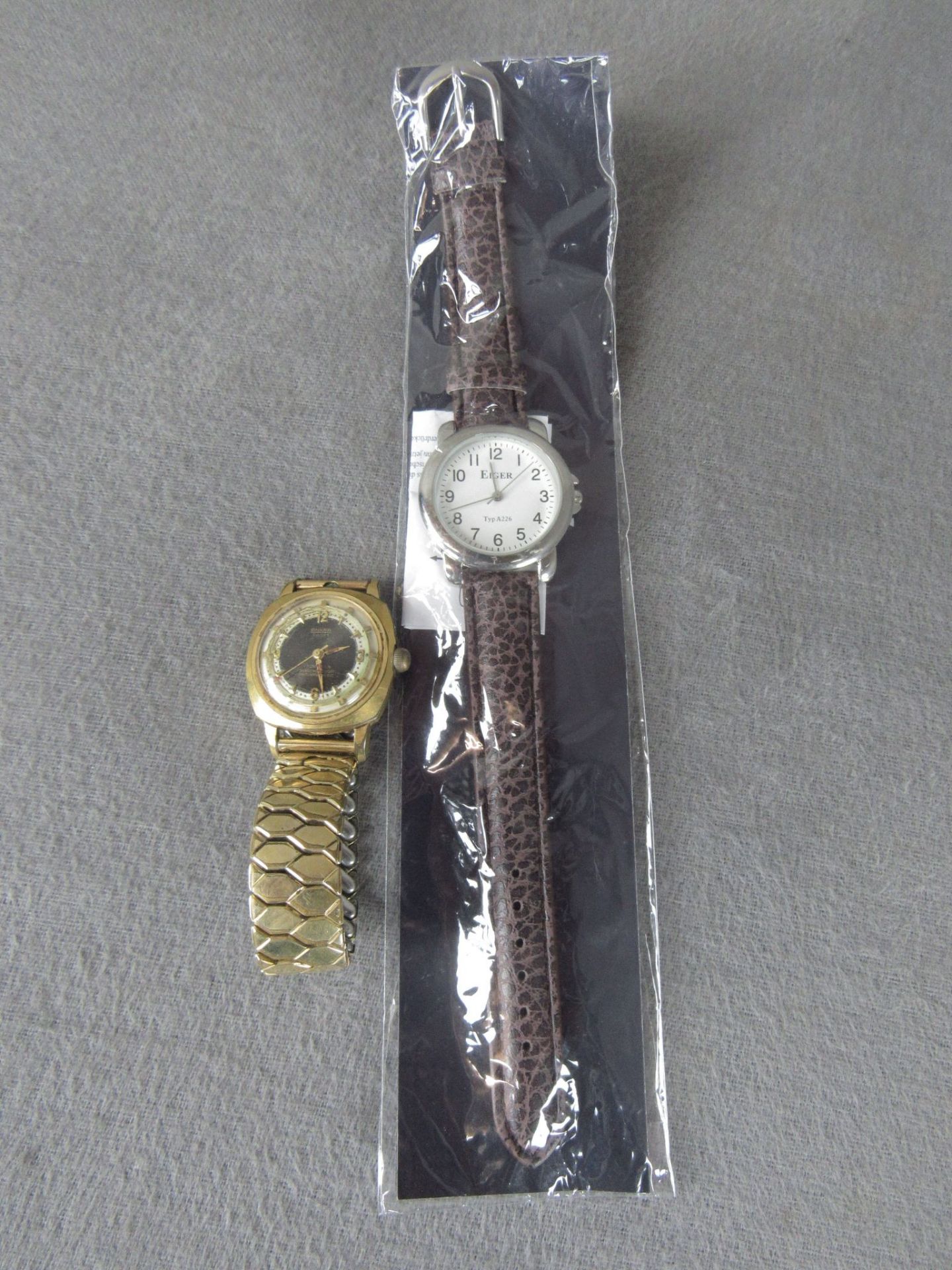Konvolut bestehend aus 2 Uhren: 1 Ankra Sport Uhr läuft an und 1x Eiger Uhr original Verpackt