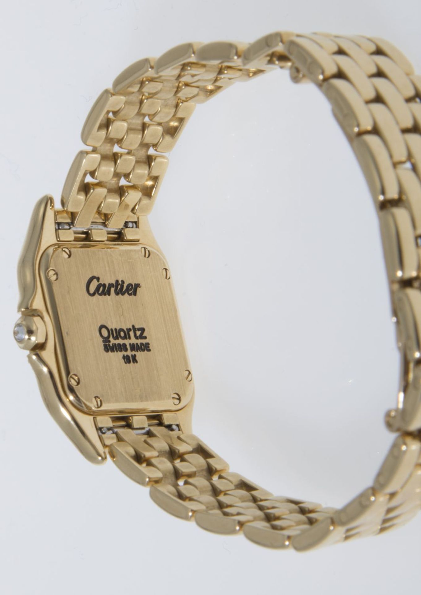 Cartier-Damenarmbanduhr "Panthère" mit reichem Diamant-BesatzGehäuse und Armband aus Gelbgold 750. - Bild 3 aus 3