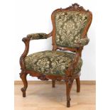 Sessel im Barockstil, 19. Jh., nußbaumfarben, beschnitzt, Sitz und Rückenlehne mit grunem,floral
