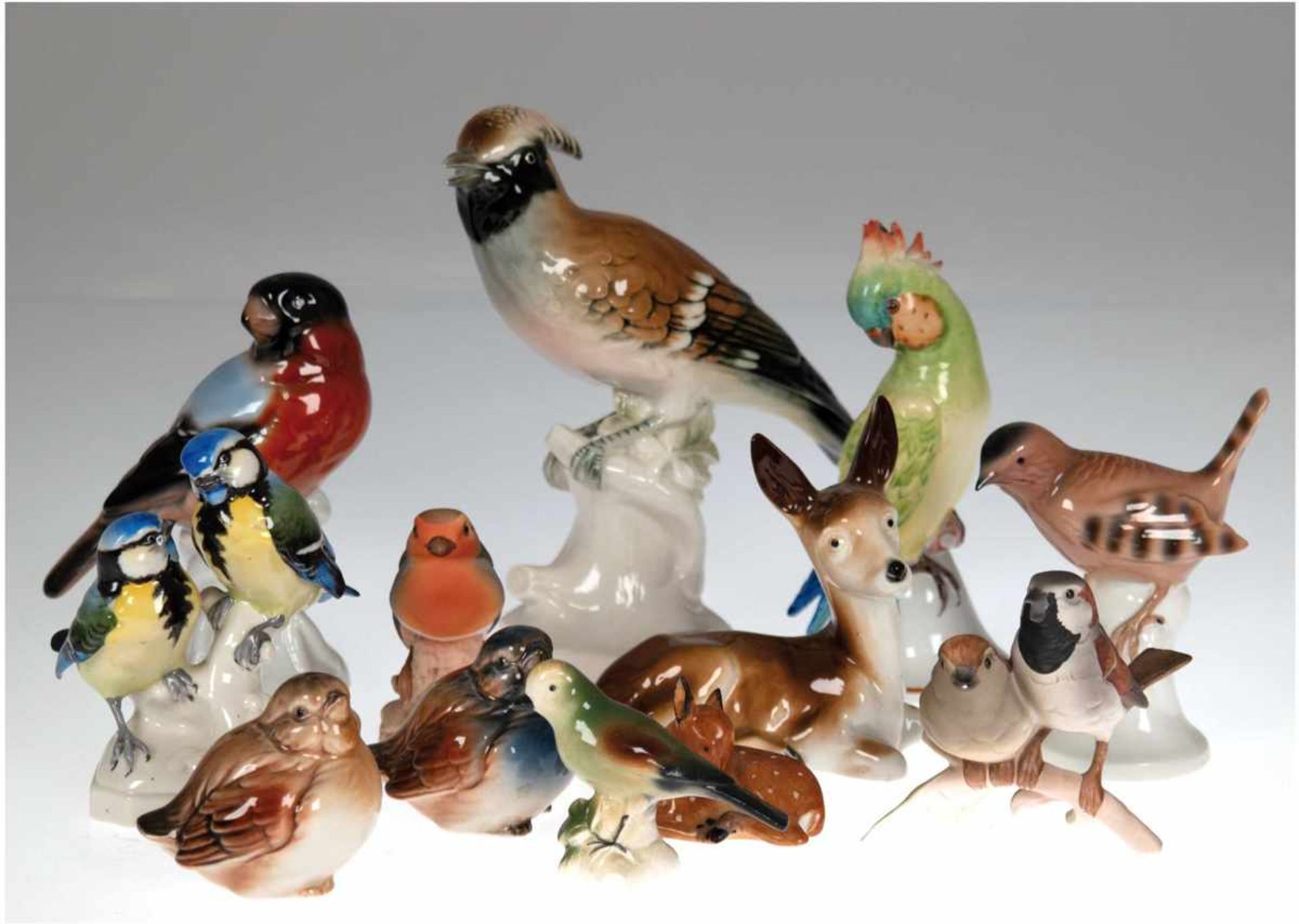 Konvolut Porzellanfiguren, dabei Unterweißbach, Volkstedt und Goebel, 10 Vögel und 2 Rehe,1 Figur