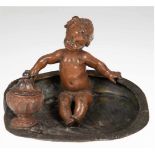 Bronzeschale mit Régule-Figur "Putto", mit Tintenfaß, sign. Kossowski, 14,5x20x15 cm