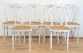 6 Stühle, wohl Thonet, Bugholz weiß gefaßt, Sitz mit Rohrgeflecht, z.T. beschädigt,88x43x50 cm