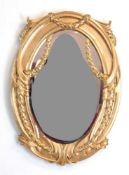 Jugendstil-Spiegel, Holz mit Stuckverzierungen, gold gefaßt, ovales geschliffenes Glas,94x67 cm