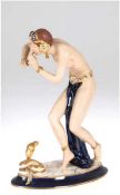 Porzellan-Figur "Schlangenbeschwörerin", Royal Dux, Tschechien, polychrom bemalt mitGoldstaf