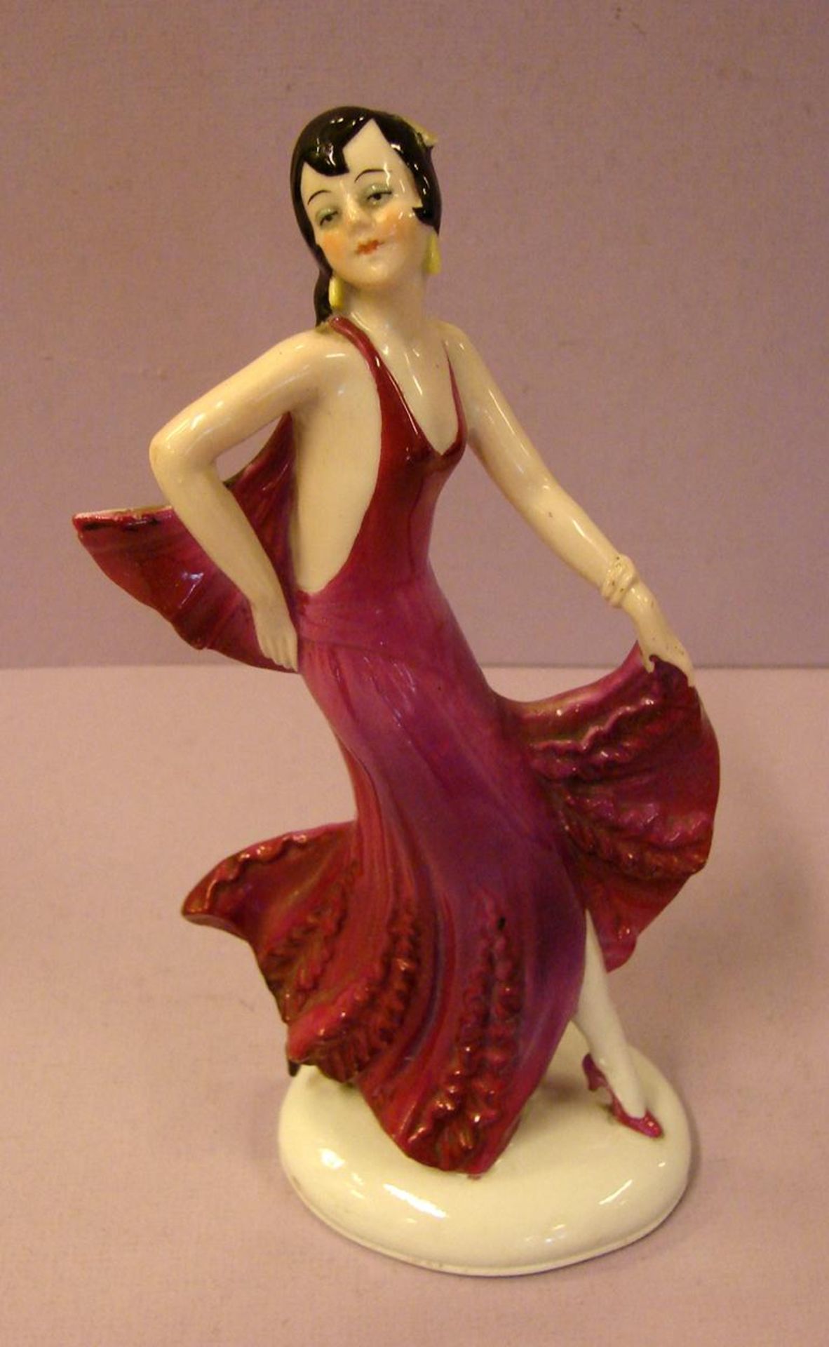 Porzellanfigur, "Tänzerin", Art Deko, Rückseitig nummeriert, H. ca. 21, oben leicht beschädigt