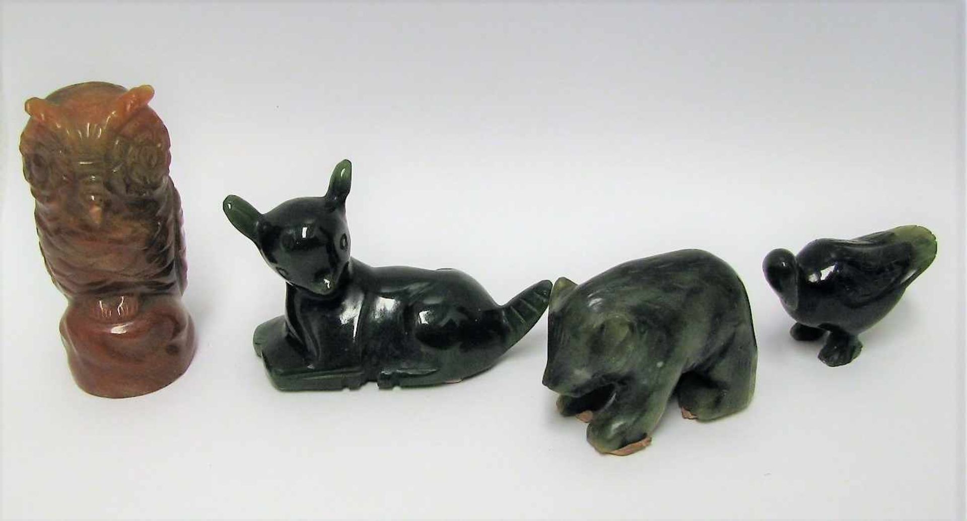 4 diverse Tierfiguren, Jade beschnitzt, ca . h 7 cm.