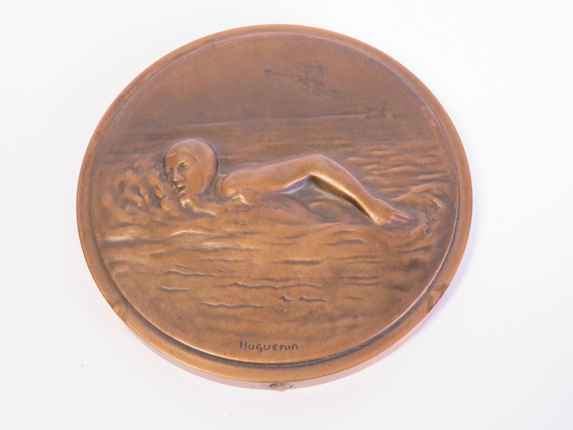 Medaille mit Schwimmerin, Schweiz, sign. "Huguenin", Bronze, 1 x 11 cm.