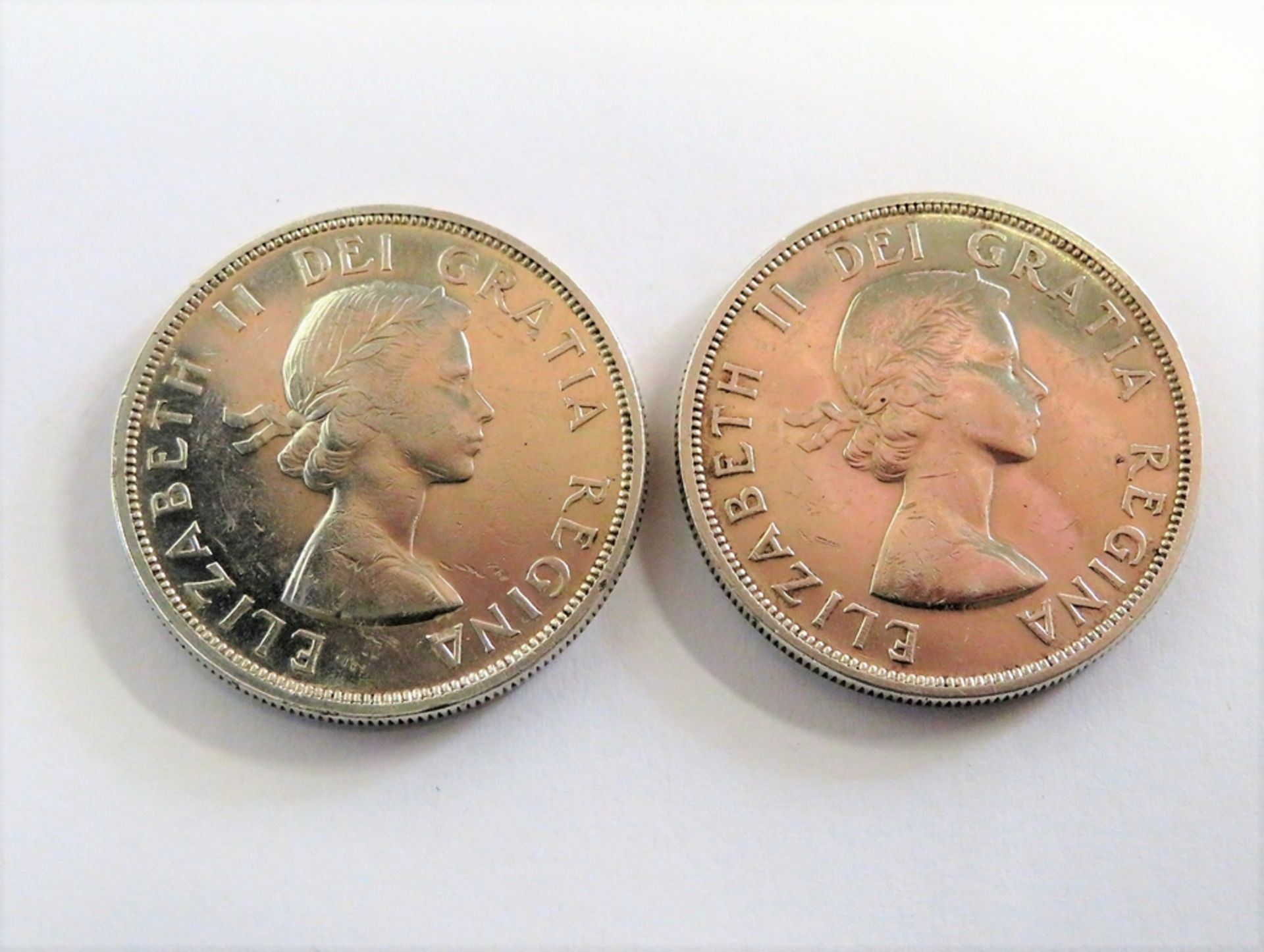 2 Silbermünzen, Canada, Dollar, Elizabeth II., 1958/1962, 46 g, d 3,5 cm.