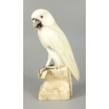 Falke, Alabaster, 1.Hälfte 20.Jh., auf einem Podest sitzend, mit Glasaugen, H.14,8cm, Reste von