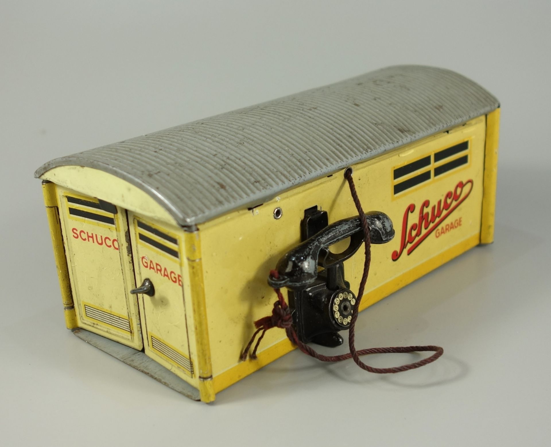 Schuco Garage 1500, 1950er Jahre, Blechspielzeug; mit Außentelefon, durch Ziehen an der Hörerschnur,