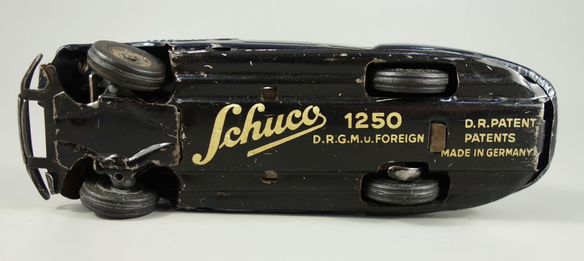 Schuco, schwarzer Freilaufrenner, Modell 1250, 1950er Jahre, Blechspeilzeug, Uhrwerkantrieb, L.14cm, - Bild 2 aus 2