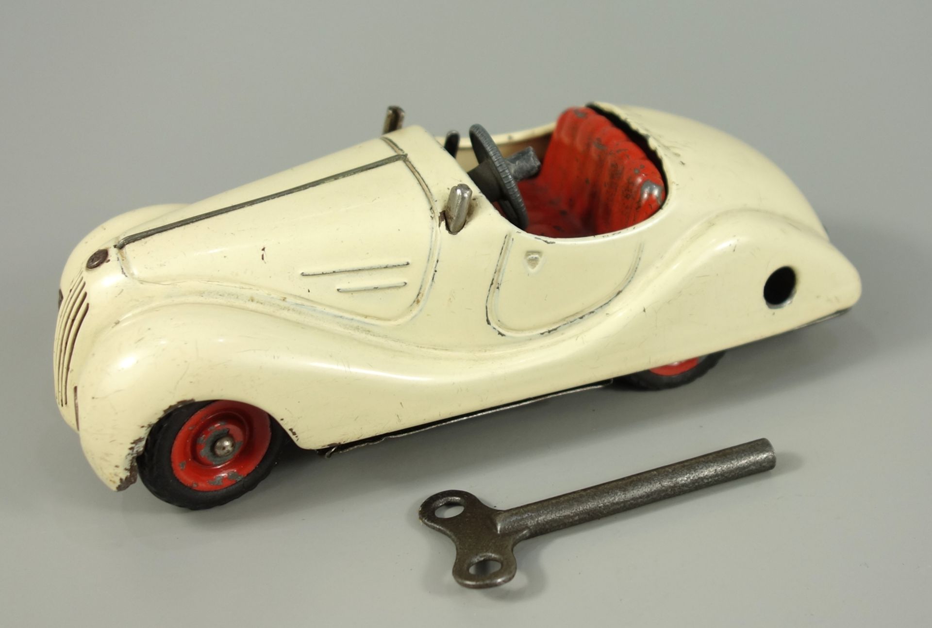 Schuco, Akustico 2002, Cabrio, 1950er Jahre, Blechspielzeug, handlackiert, cremeweiß, mit Uhrwerk,