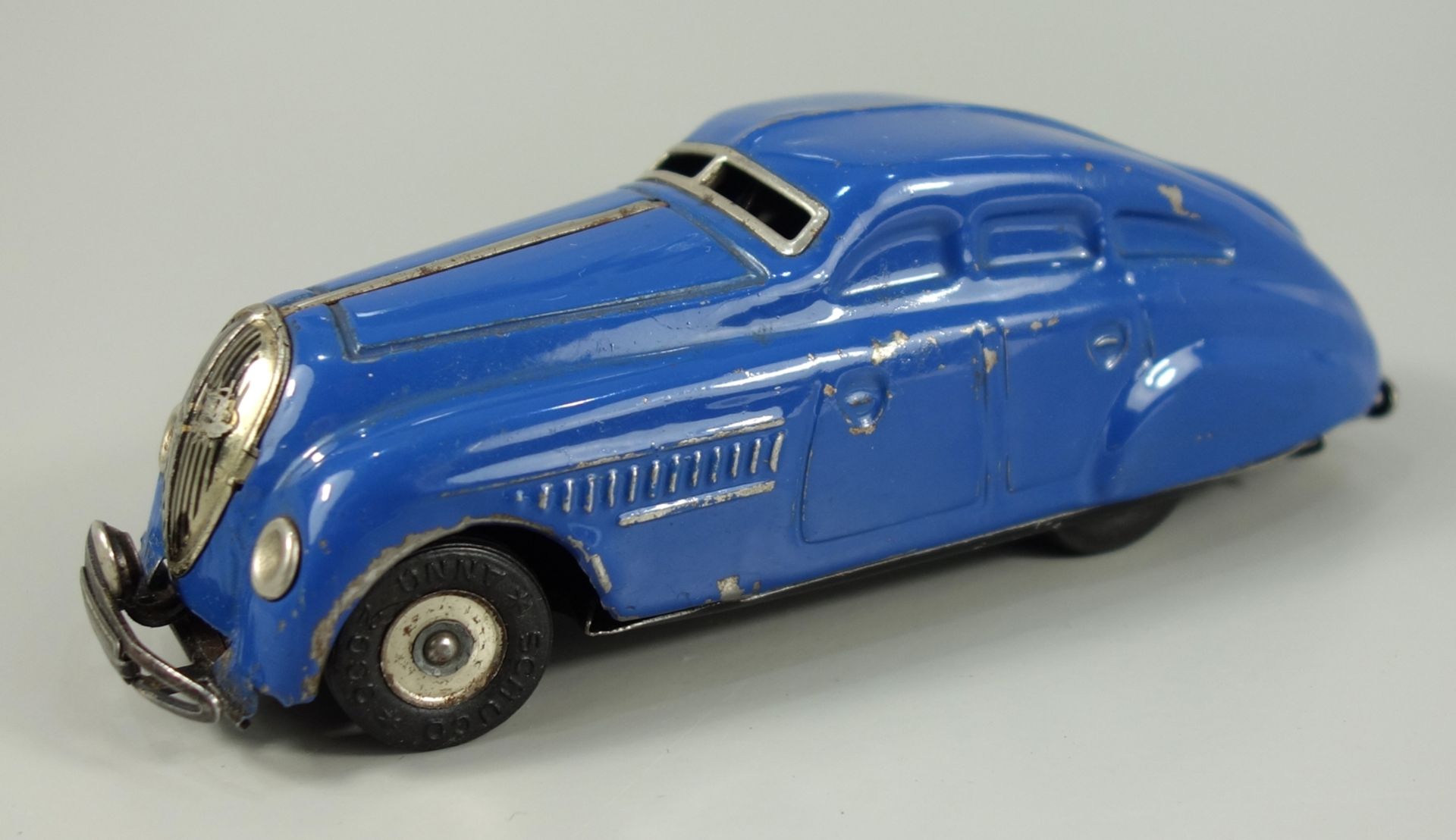 Schuco, blaues Garagen-Auto mit Uhrwerkmotor, Modell 1750, 1950er Jahre, Blechspielzeug, L.14,5cm,