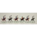 6 Zinnfiguren, Anfang 20.Jh., Flachrelief, Soldaten zu Pferd mit Fahne, H.4,2cm, beidseitig bemalt,