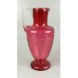 Glaskrug, um 1900, H.23,5cm, Klarglas purpur unterfangen, Stand mit Abriss, eingezogene Schulter,
