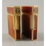 2 Feuerzeuge mit Monogramm, S.T. Dupont, Paris, vergoldet, mit Chinalack, monogrammiert "GB",