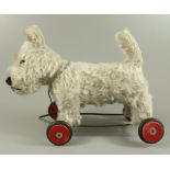 Zieh-Hund, wohl 1950er Jahre, Drehkopf mit Glasaugen und Kunststoffnase, Holzwolle gestopft,