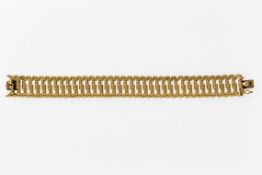 GliederarmbandGG, 750. Stäbchenmuster. Unterbaute Kastenschließe mit Achtersicherung. L. 19 cm. B.
