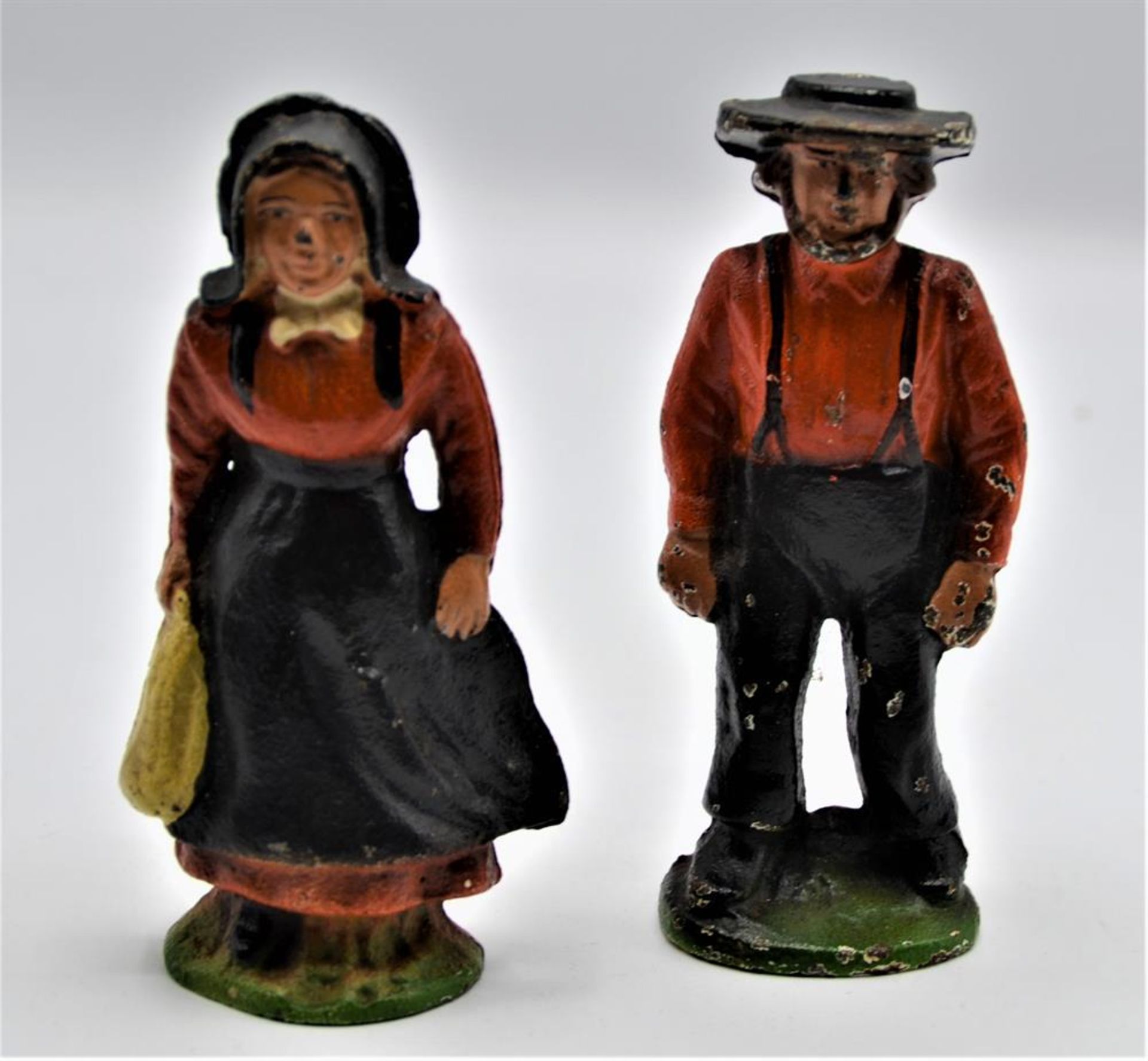 Figuren Paar Amish Mann u. Frau, Gusseisen handbemalt, Farbabplatzer u. Bestossungen vorhanden,