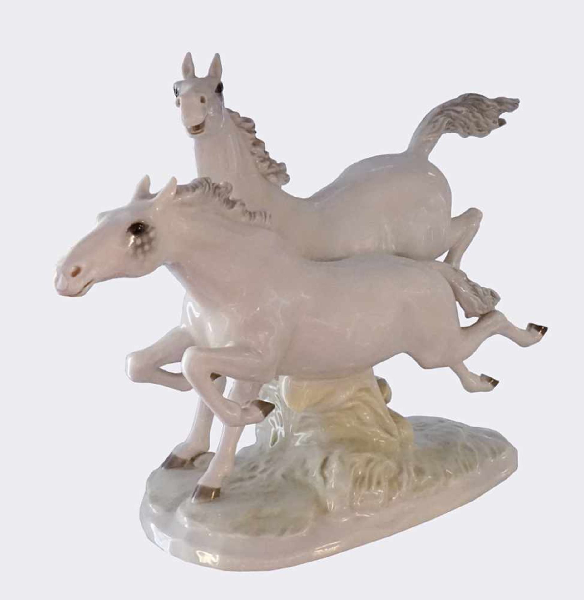 Figurengruppe Porz. HUTSCHENREUTHER"Galoppierende Pferde" L ca. 40cm gechippt Asp.