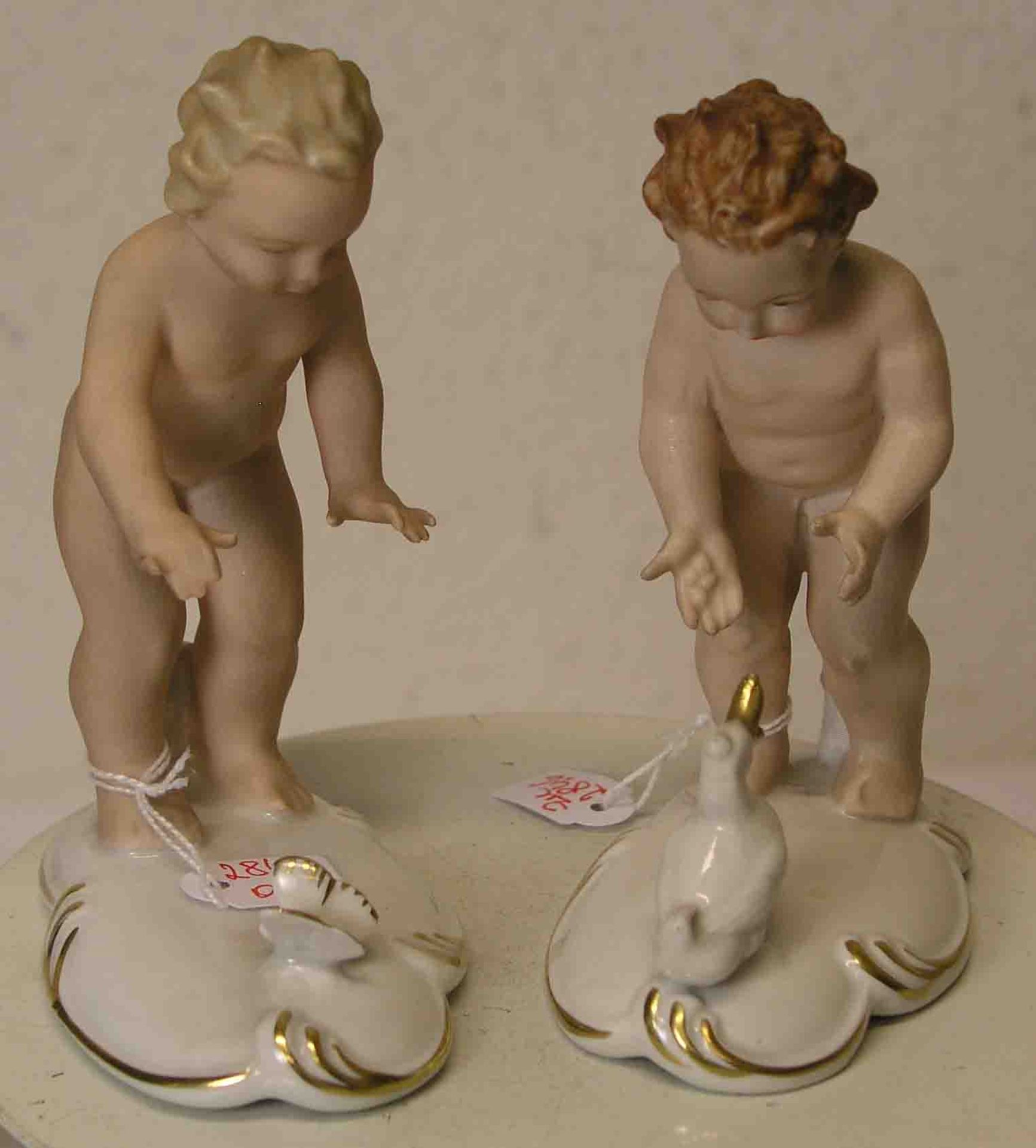 Zwei Porzellanfiguren, Gerold, Tettau: "Junge mit Schmetterling" und "Junge mit Ente".Farbig