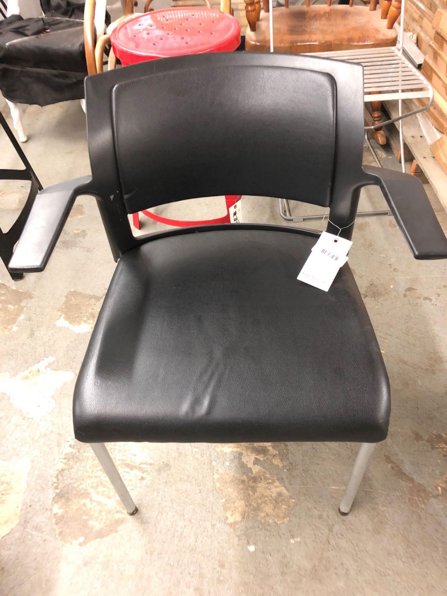 Black padded arm chair