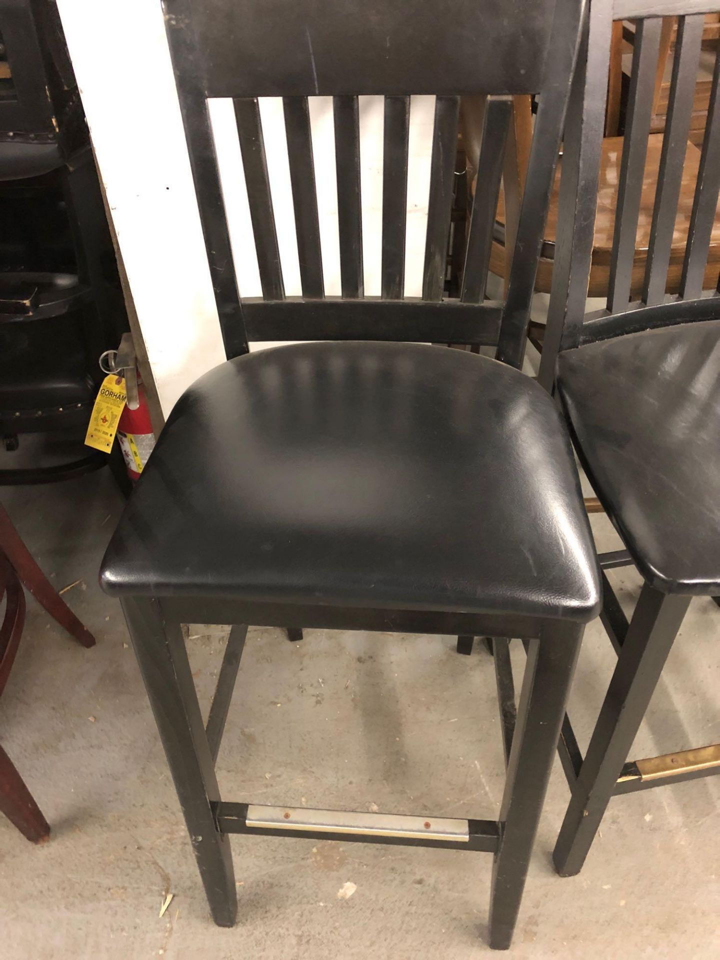 Assorted black stools and chair